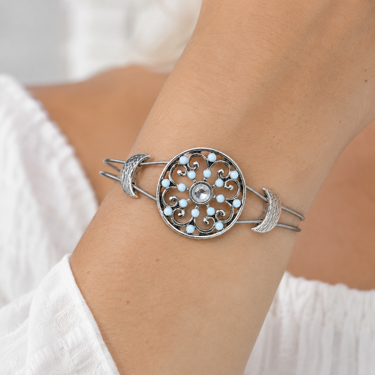 Light blue and silver rhinestone bracelet on wrist
