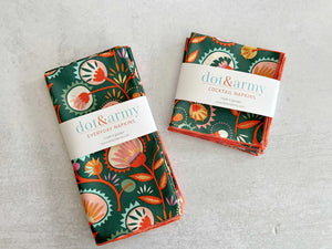 Set of four Dot and Army Desert Bloom cloth napkins with floral pattern.