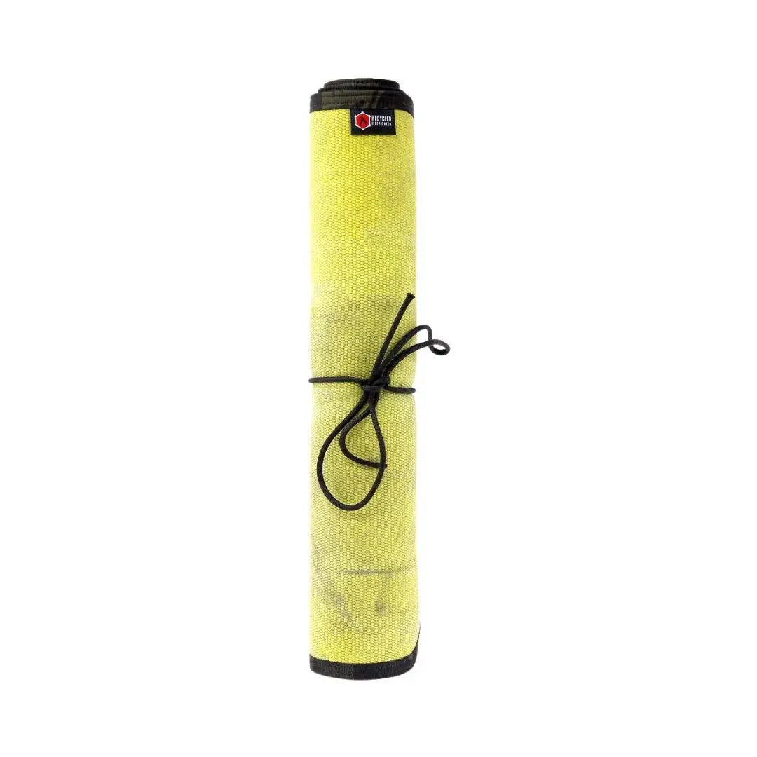 Rolled yellow fire hose mat with black binding and black paracord tie.