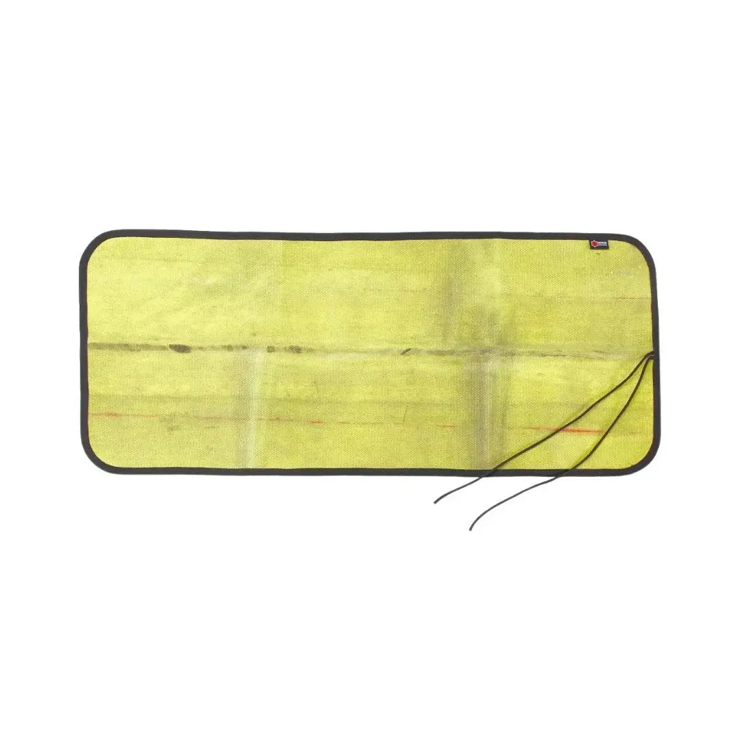 Yellow repurposed fire hose mat with black binding and paracord ties on a white background.