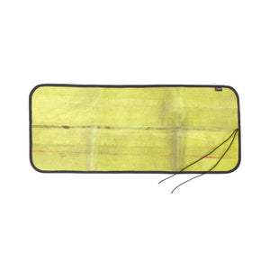 Yellow repurposed fire hose mat with black binding and paracord ties on a white background.