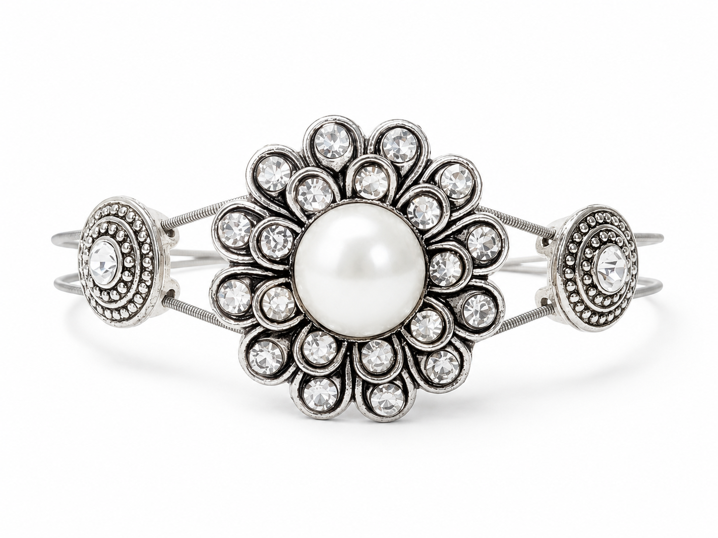 Silver rhinestone and pearl bracelet on white background