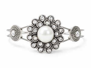 Silver rhinestone and pearl bracelet on white background