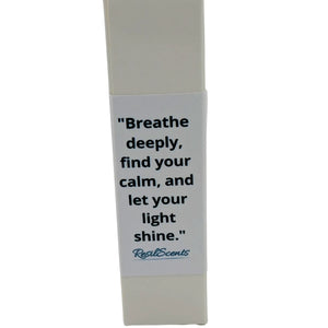ResilScents roll-on oil packaging with quote: \"Breathe deeply, find your calm, and let your light shine.\"