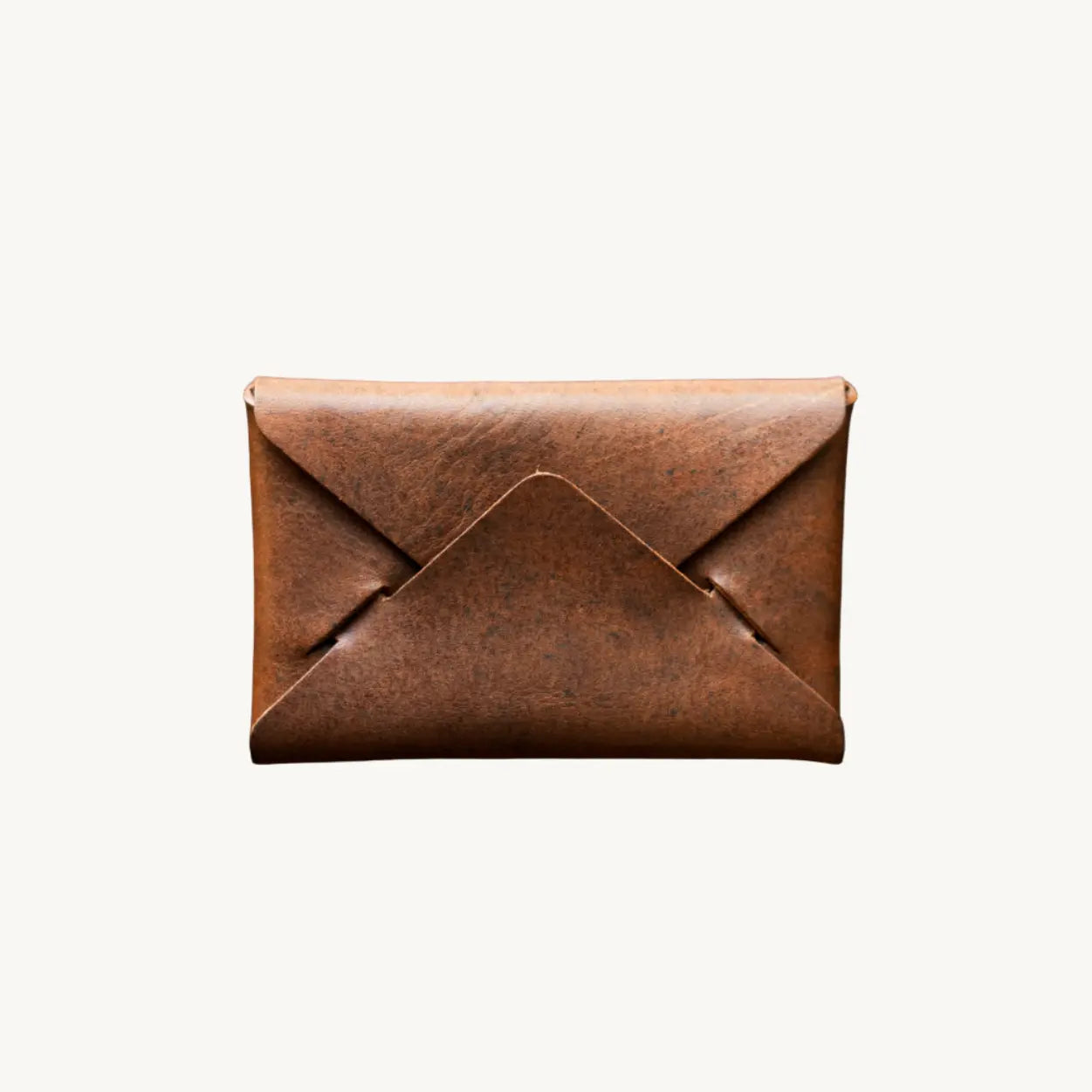 Cognac Nemesis Leather Envelope Wallet from Main Street Collective. Small, brown, and foldable.