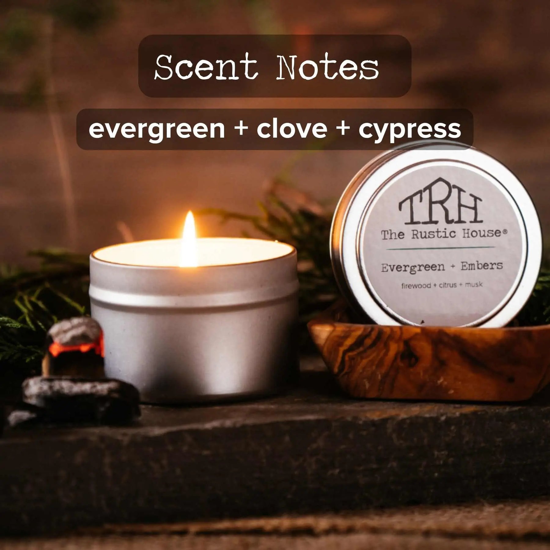 The Rustic House Evergreen + Clove + Cypress scented travel tin candle.