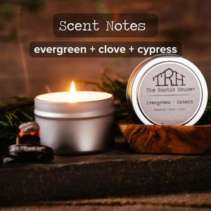 The Rustic House Evergreen + Clove + Cypress scented travel tin candle.