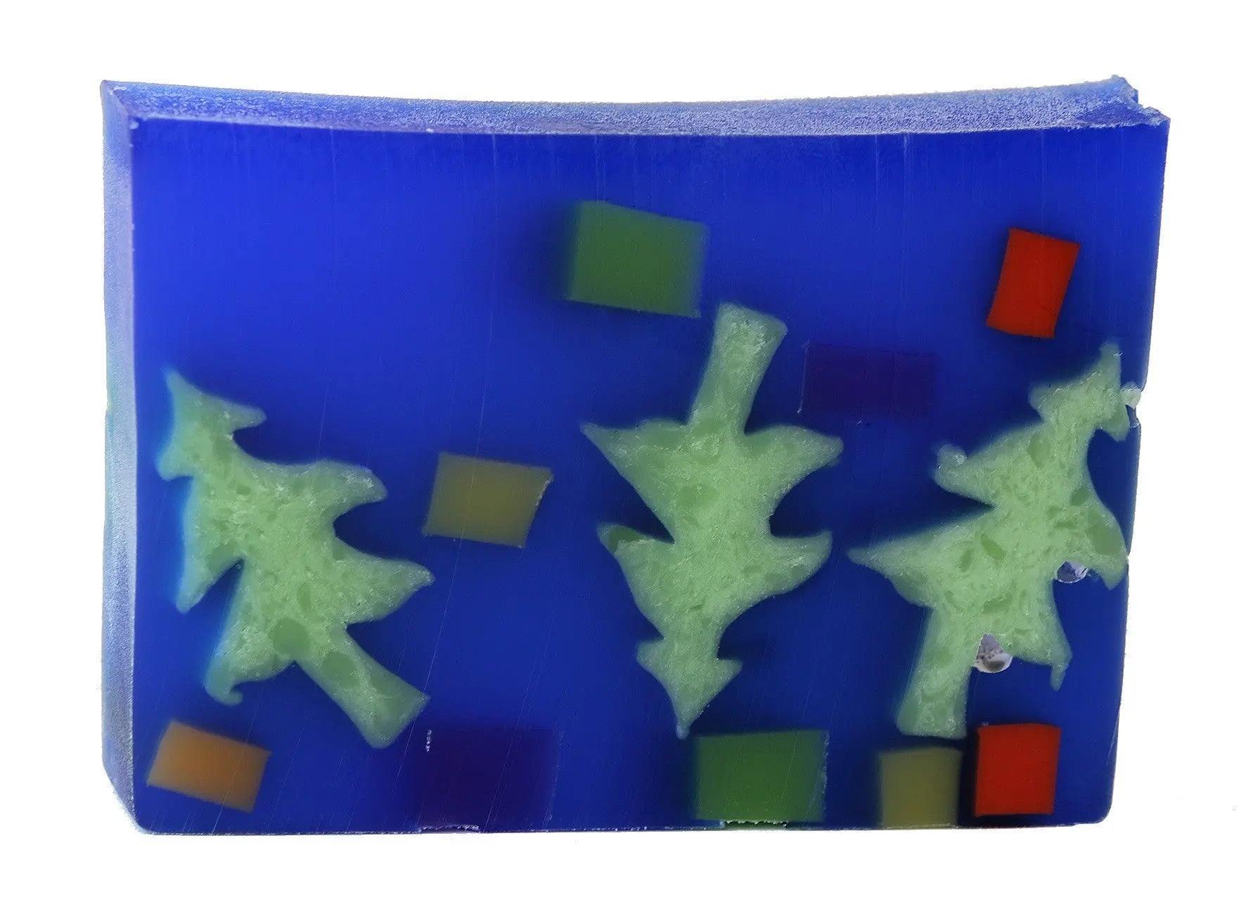 Translucent blue soap slice with green Christmas tree shapes and colorful squares.