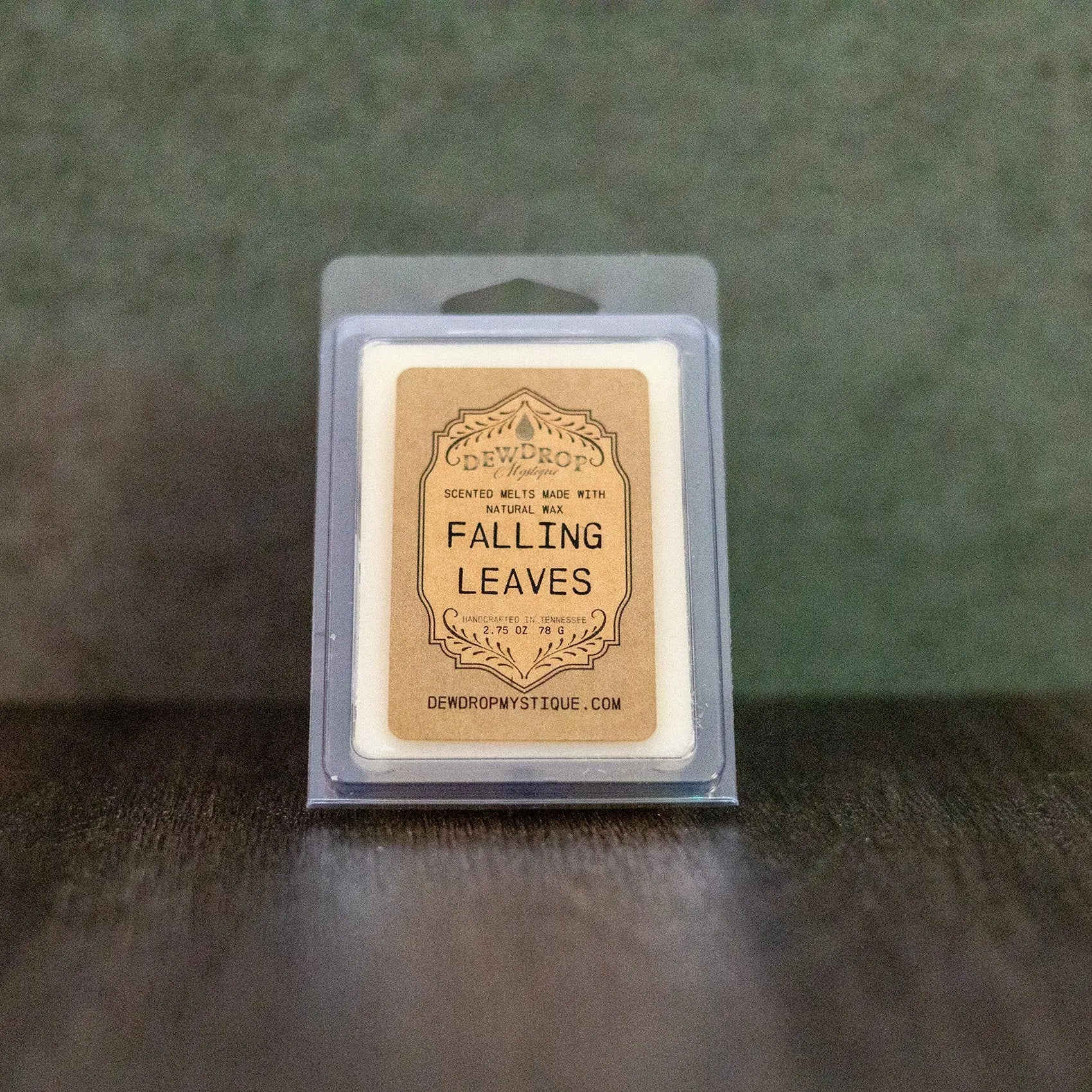 Falling Leaves scented wax melt in clear plastic packaging with brown label, Dewdrop Mystique brand.