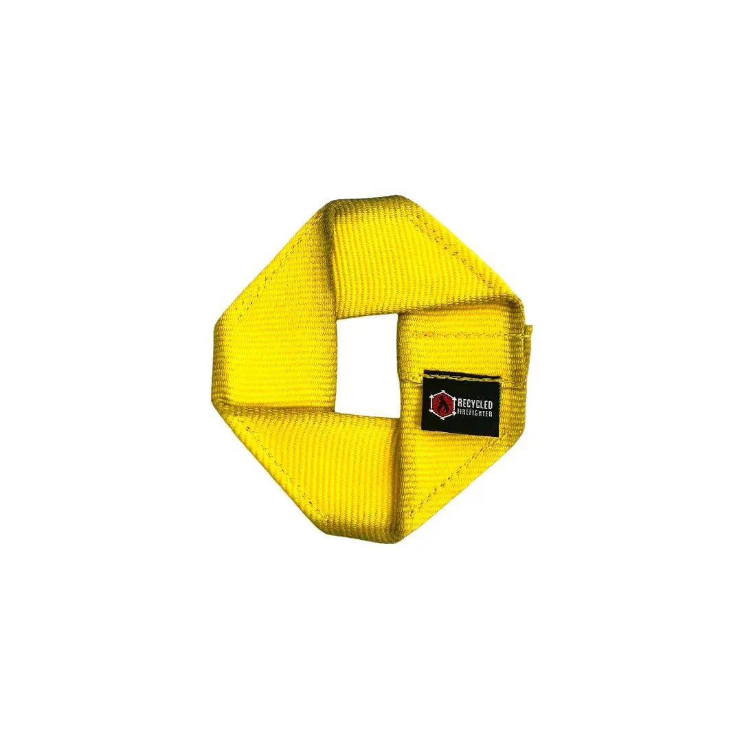 Yellow fire hose dog frisbee with Recycled Firefighter logo.