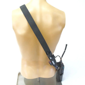 Firefighter radio strap with attached radio and clips on a mannequin.