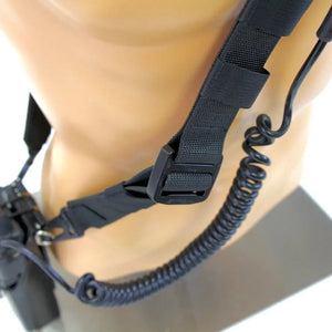Black firefighter radio strap with adjustable buckle and coiled cord.