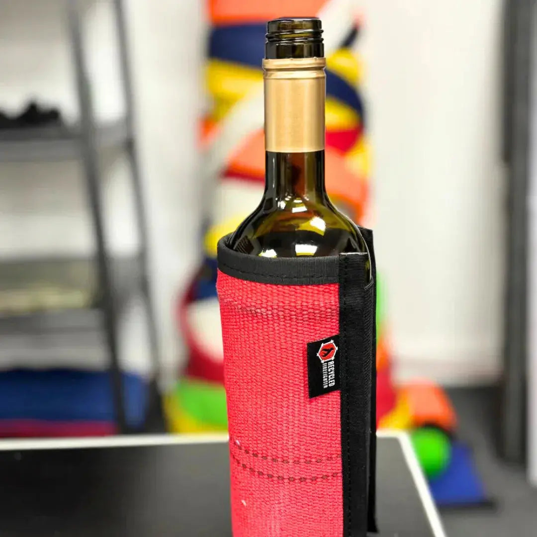 Red fire hose wine bottle sleeve with black trim