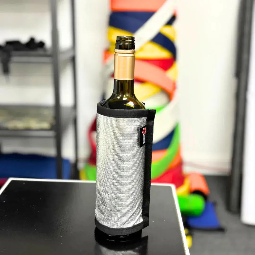 Firehose material wine bottle cover on a glass bottle.