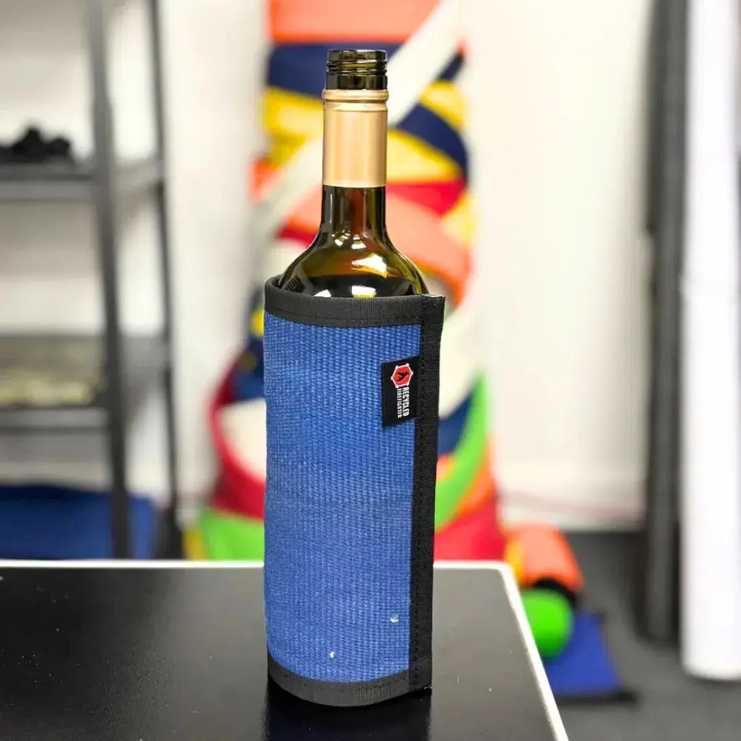 Blue firehose wine bottle cover on a table