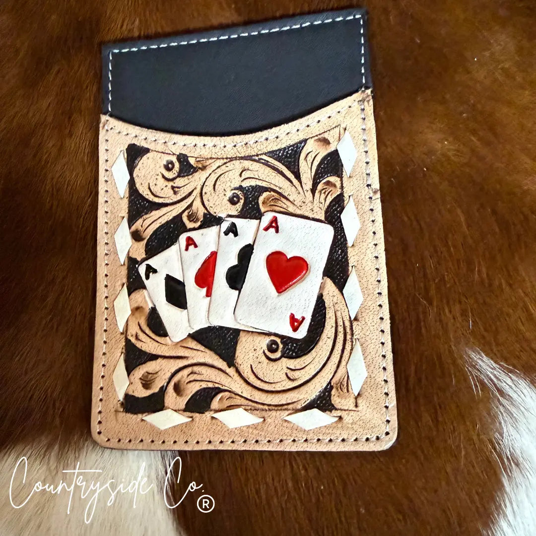 Tooled leather credit card holder with four aces playing cards and black top slot.
