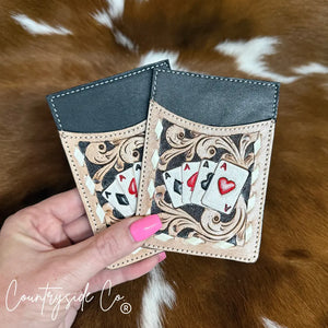 Gambler tooled leather card holder with hand-painted ace cards and tooling.