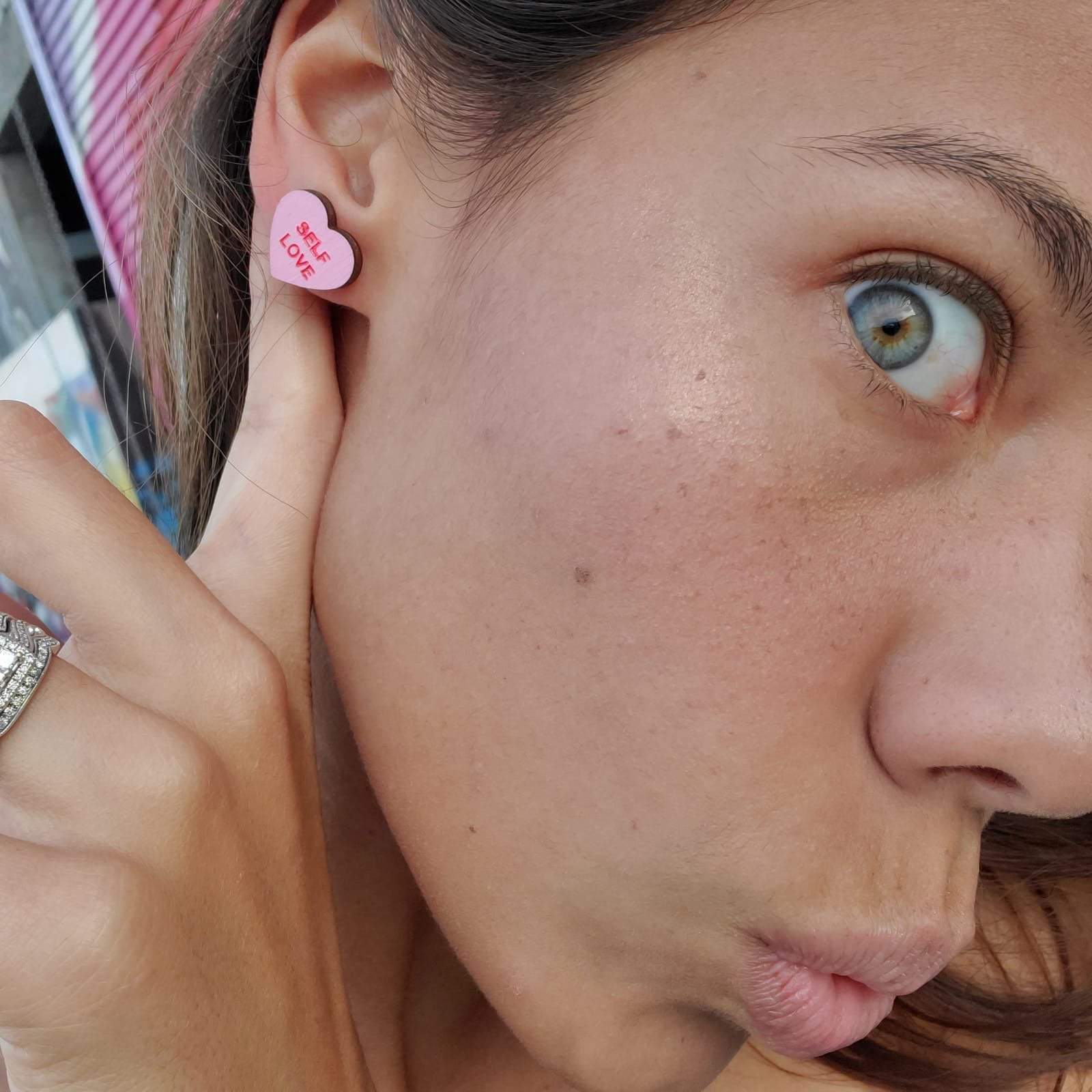 Additional view of Self Love Candy Heart Stud Earrings hand painted on lightweight wood by LE CHIC MIAMI