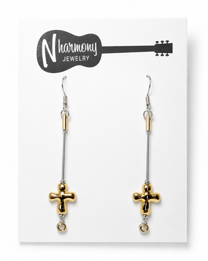 Gold cross earrings on a 'Harmony Jewelry' card
