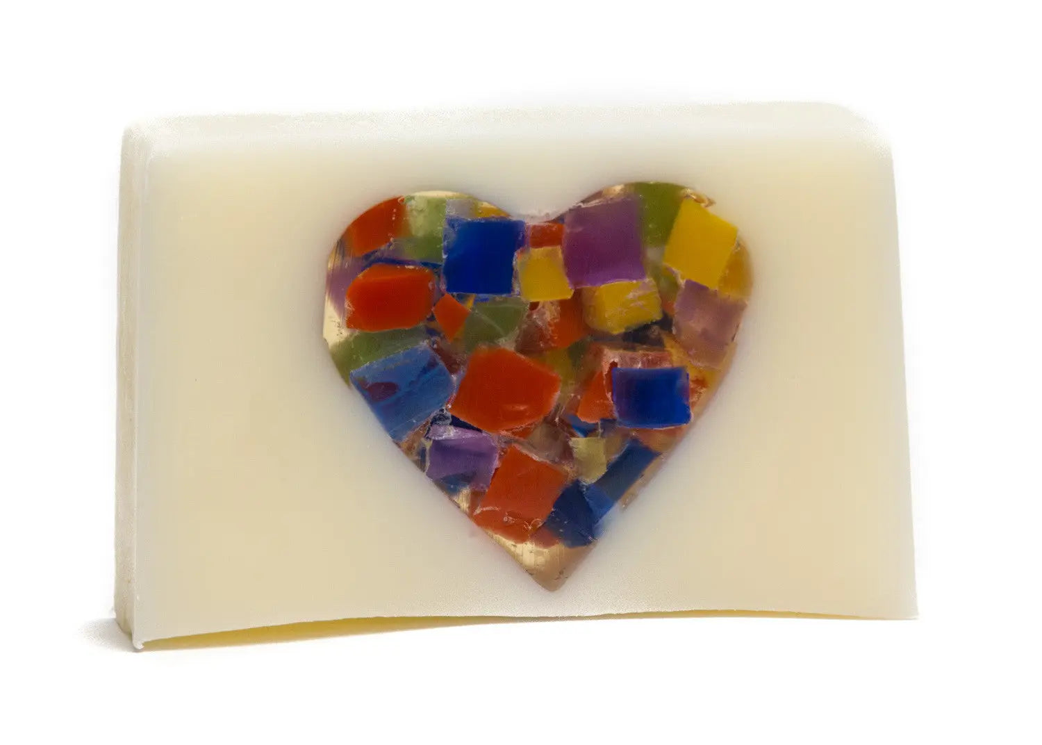 Creamy white bar soap with a mosaic heart embedded in the center.