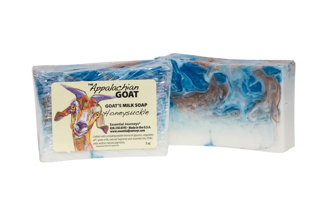 Honeysuckle Goat Milk Soap slice with blue and white swirl and goat illustration label.