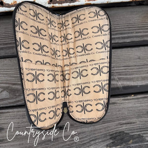 Leather carry case with horseshoe pattern lining and Countryside Co. branding.