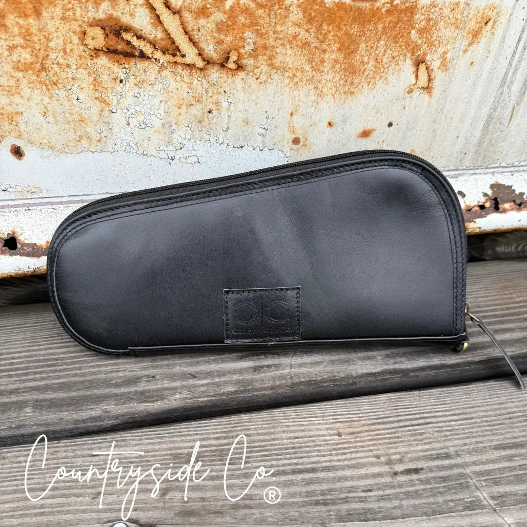 Black leather carry case with Countryside Co. logo.