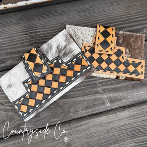 Main Street Collective cowhide wallet with black and tan checkerboard pattern