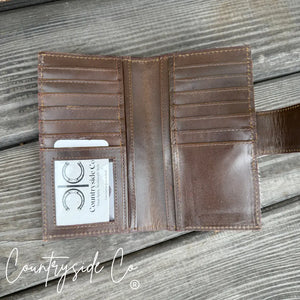 Brown leather wallet with multiple card slots and pockets inside.