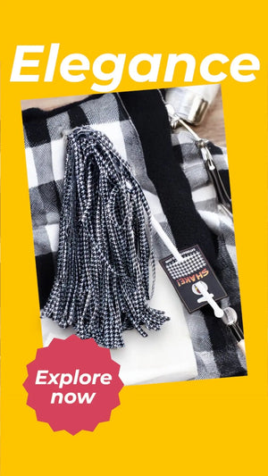 Houndstooth pom-pom shaker with white handle