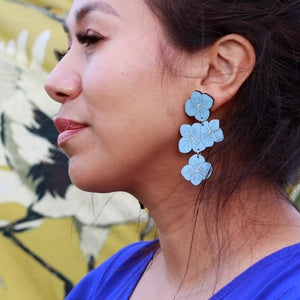 Additional view of Powder Blue Hydrangea Statement Earrings hand painted on lightweight wood by LE CHIC MIAMI