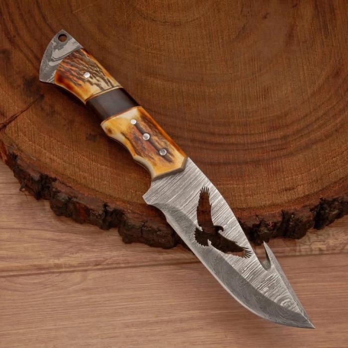 Eagle Cutout Skinner Knife with Stag Handle and Patterned Steel Blade