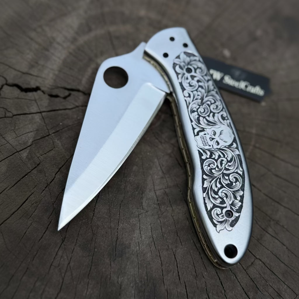Hand Engraved D2 Steel Folding Pocket Knife — Mirror Polished Leaf Blade, Skull Floral Scroll Stainless Handle by JW SteelCrafts, Damascus knife main product photo