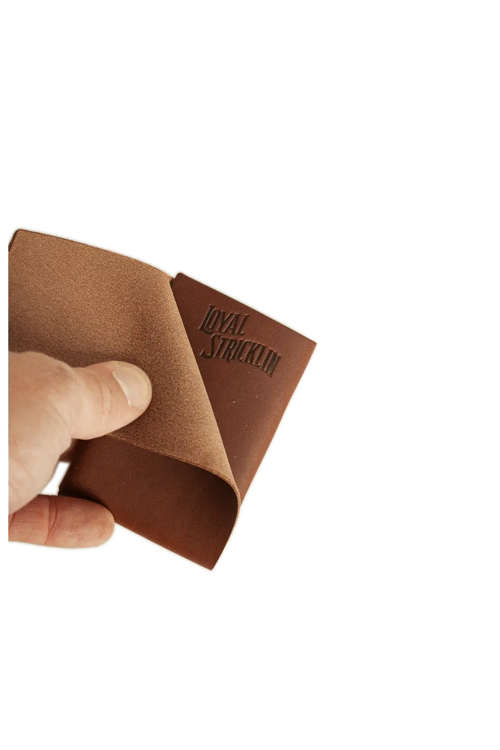 Loyal Stricklin walnut brown leather card wallet being held and opened to show the interior.
