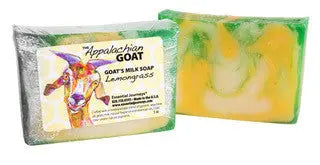 Two slices of lemongrass goat milk soap, one wrapped, showing yellow and green marbled colors.