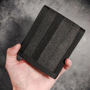 Black fire hose bifold wallet held in hand