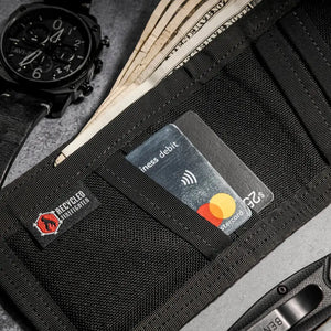 Black bifold wallet with credit cards, cash, and a watch.