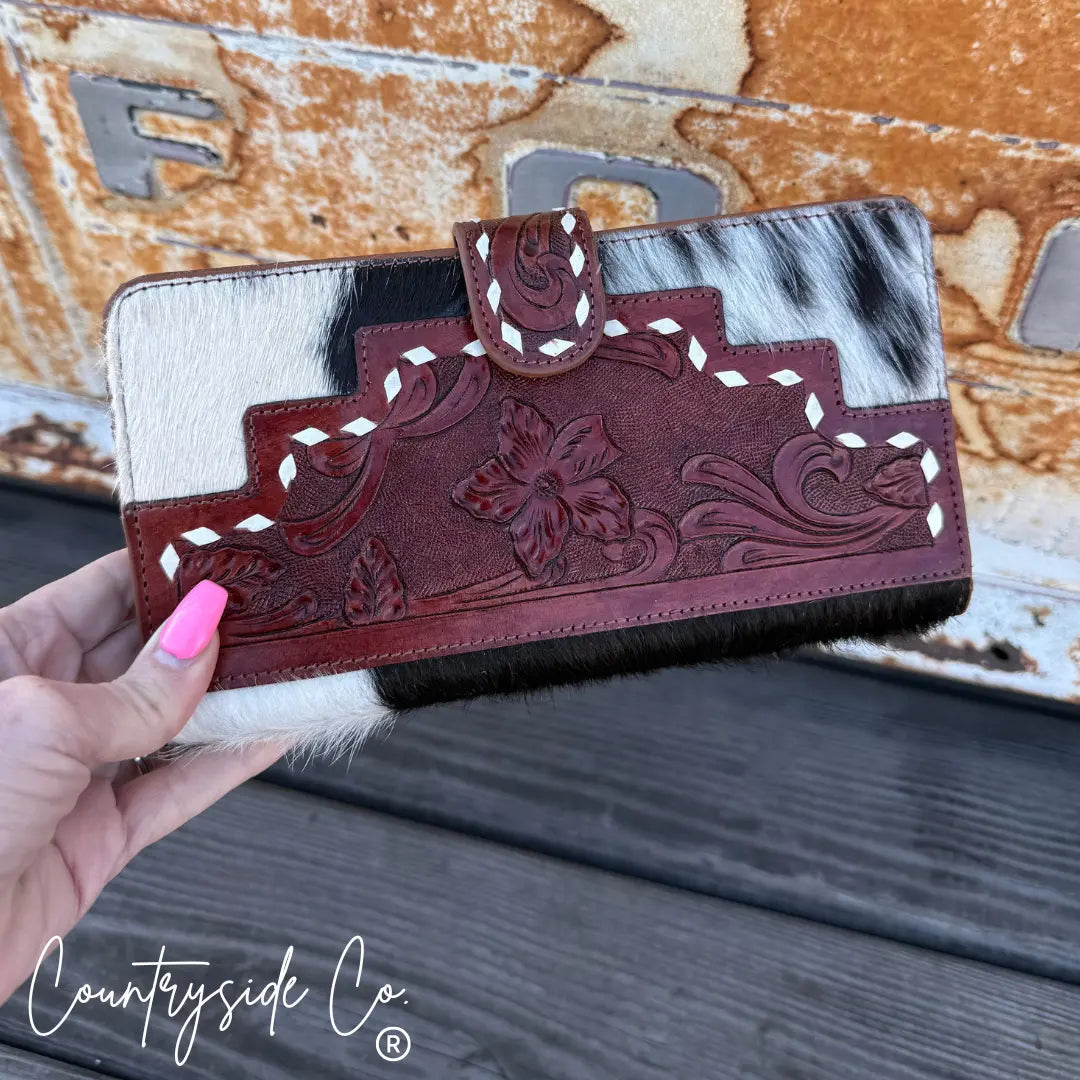 Loretta cowhide wallet by Countryside Co. with tooled leather floral design.