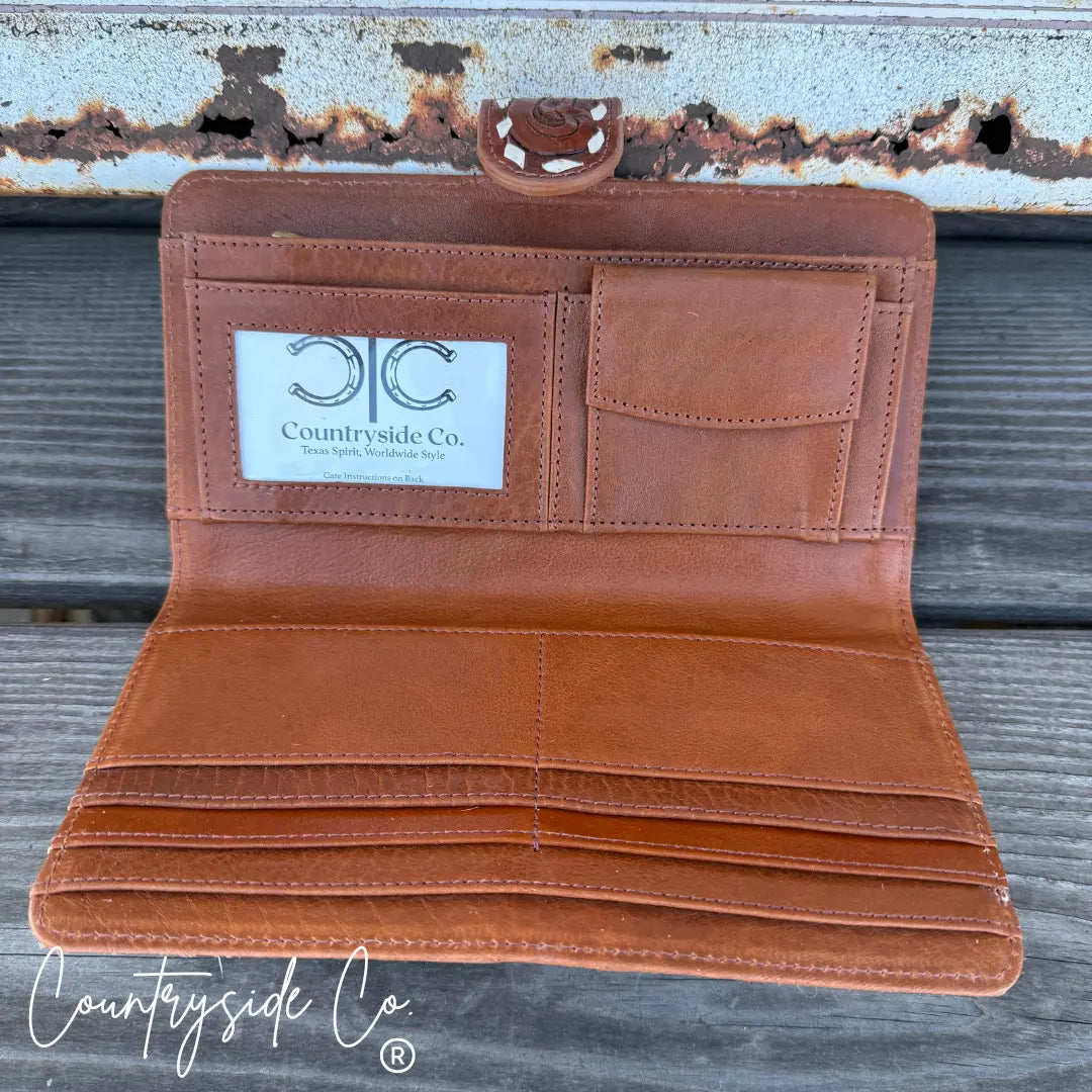 Brown tooled leather and cowhide bifold wallet with card slots