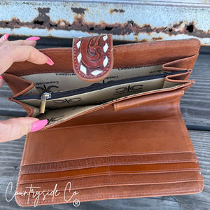 Brown leather Loretta Cowhide Wallet by Countryside Co. with card slots and zipper pocket.