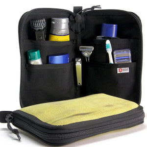 Open black toiletry bag with grooming essentials organized in pockets.