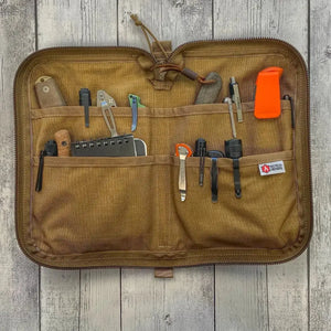 Brown Major Dopp Bag Large with multiple pockets holding EDC items like knives and pens