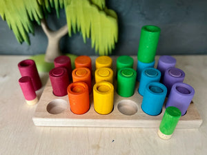 Wooden sorting tray with colorful cylinders and Grapat Lola holders