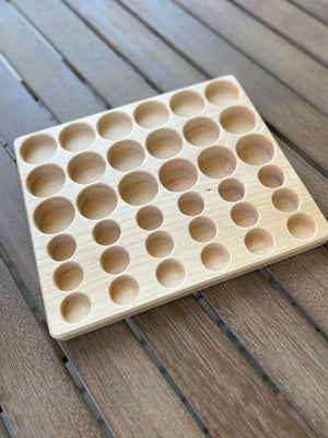Maple sorting tray with circular indentations for Grapat Lola play