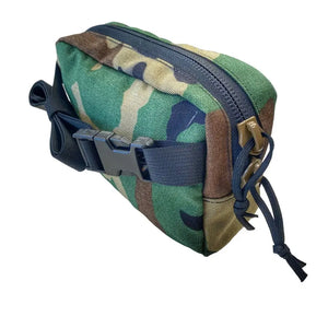 Woodland camouflage fanny pack with black buckle, zipper, and adjustable strap