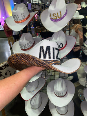 White cowboy hat with black MIZZOU letters and rhinestone trim