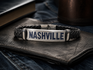 Bracelet with 'NASHVILLE' engraving on a leather surface