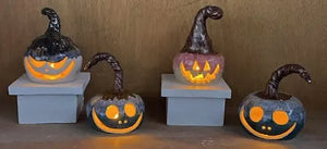 Handmade ceramic jack-o’-lanterns for the Night of the Pumpkins class