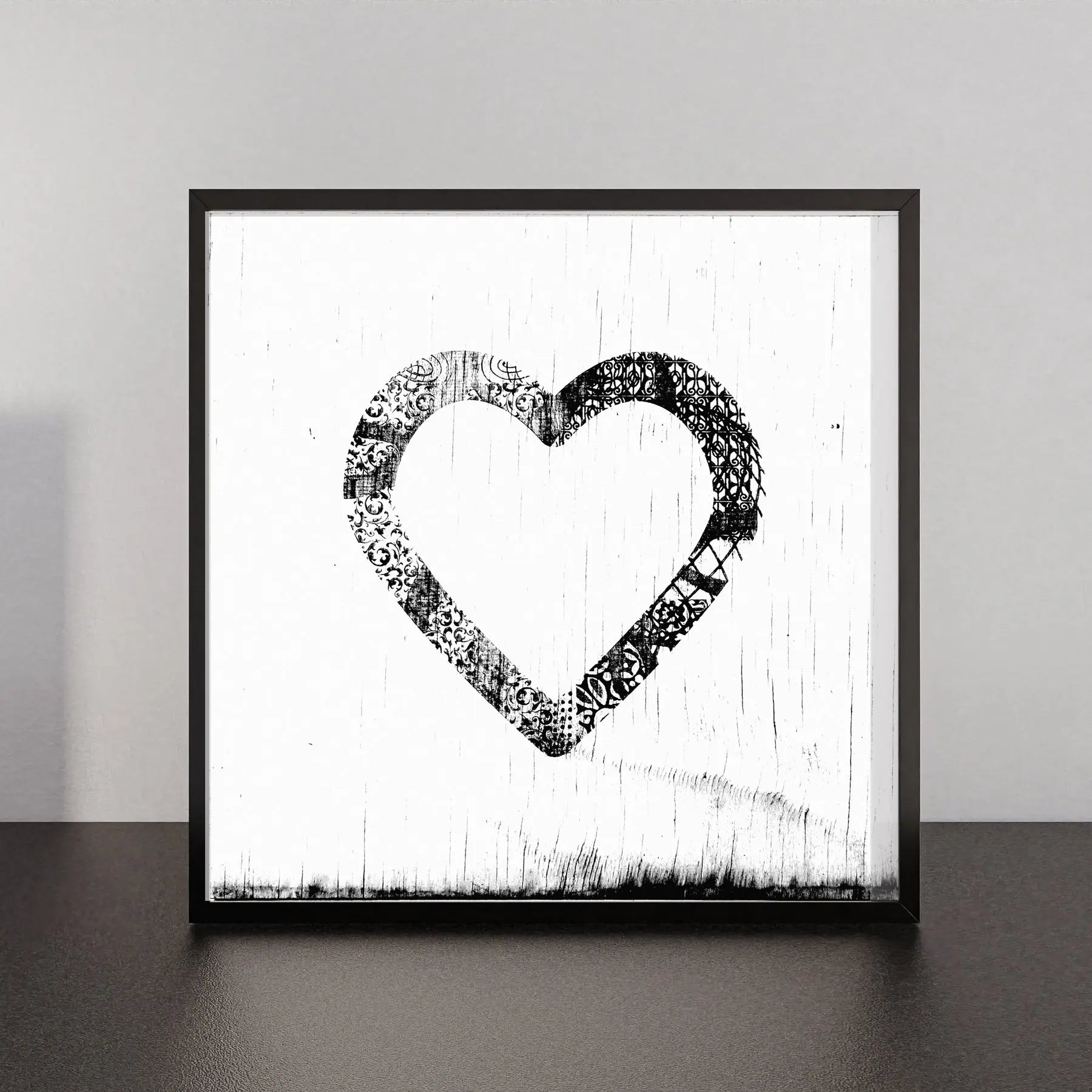 Ornamental heart artwork with black and white filigree pattern.