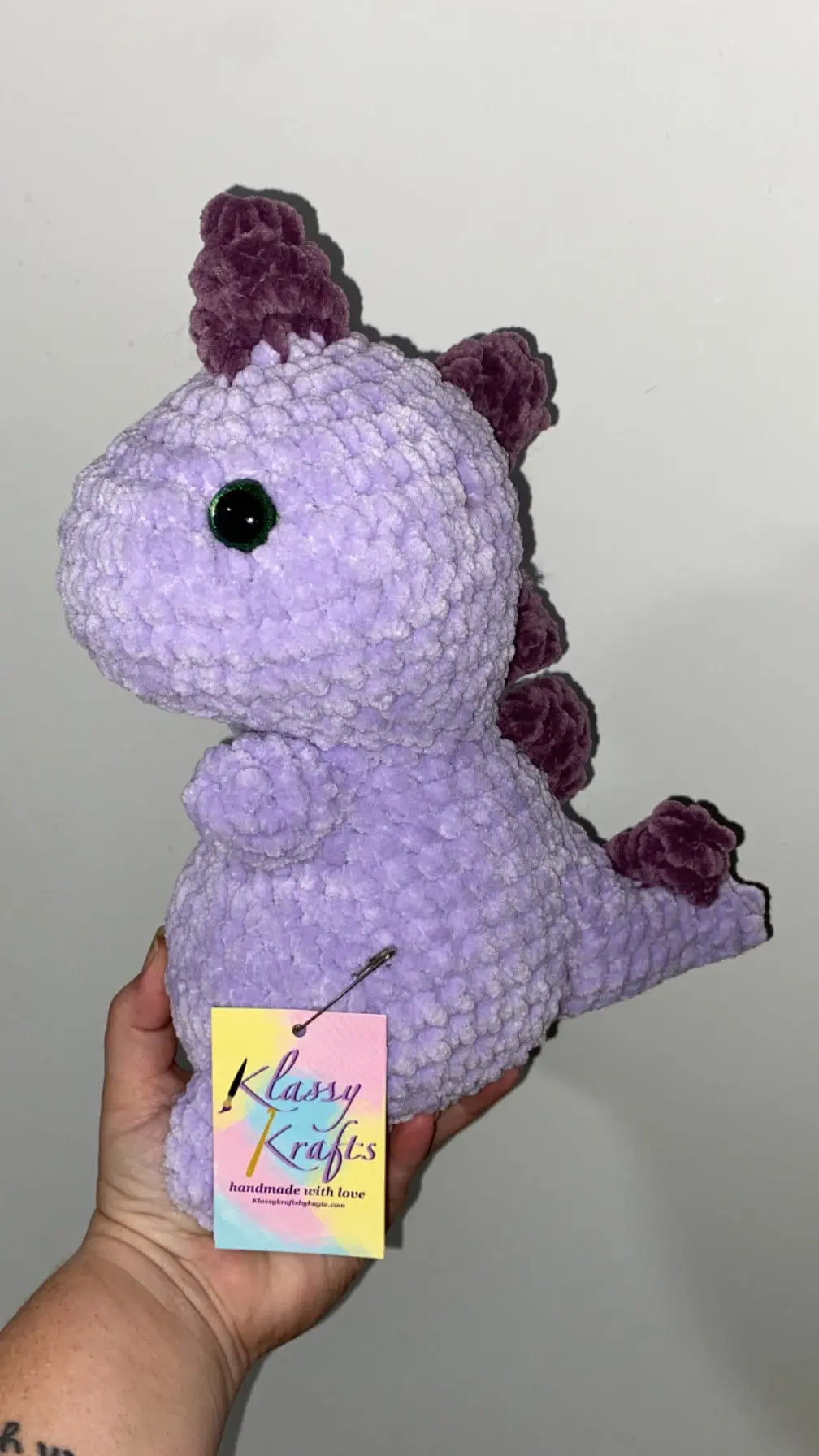 Crochet Dinosaur Plush - Penny the Purple Dino handmade by Main Street Collective. Adorable handmade purple dinosaur toy.